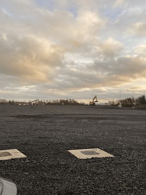 Excavation progress at the Copart Dunfermline site showing cleared ground and machinery during cut and fill operations
